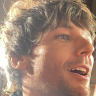 tommosgun:  Harry centric close up of him trying to decipher Lexie’s name.  Manchester 4.10.15  Beautiful video of him, if you use it please credit and tag me, thank you  