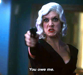 Gif 8: Angrily, she continues, "You owe me." Five's already angry expression hardens into contempt.