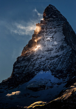 naturalsceneries:  Sun rays melting snow on the side of the Matterhorn Source: CoolbieRe (flickr)  