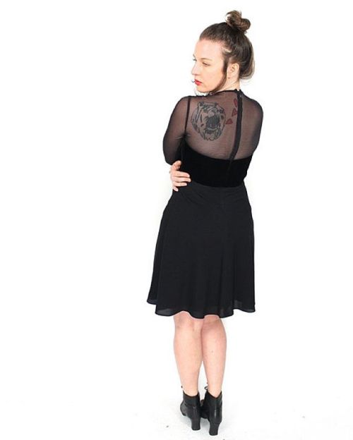 Vintage 90s black velvet mesh baby doll dress with buttons down the front and a flirty skirt. Size s