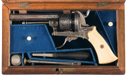 Cased and engraved Belgian pinfire folding trigger revolver with ivory grips, 19th century.