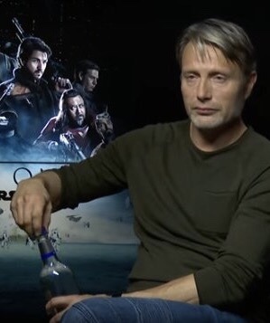 END OF 2016 MOOD: Mads Mikkelsen opening a full bottle of vodka in the middle of a Rogue One interview.