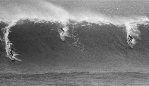 spanishguyinghent:(L to R) Unknown rider with Eddie Aikau in the lip and Miki Dora way behind the pe