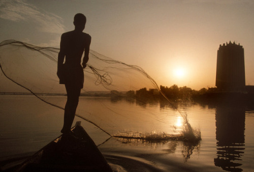 sahljournal:MALI. Fisherman at dusk on the Niger river in Bamako. 1996. A. Abbas