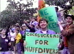 lesbianherstorian:  chris (last name unknown), david b. feinberg, john weir, and wayne kawadler held signs of solidarity, hyped up the crowd, and gave hugs at the first D.C. dyke march. footage from dyke tv, photograph by porter gifford, april 1993