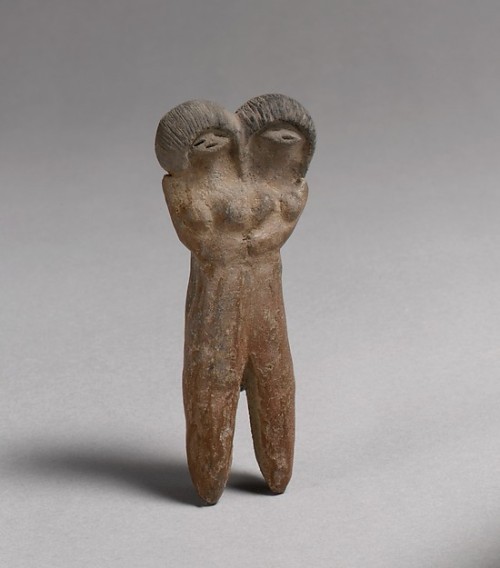 ancientpeoples:Ceramic double headed figure 8.9cm high and 3.8cm wide (3.5 x 1.5 inch.) These figure