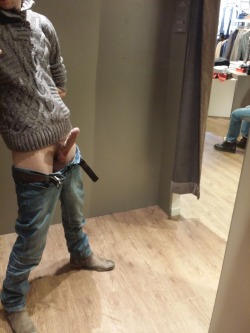 A changing room at a clothing store is the backdrop for this beautiful and erotic display of a very hot erect cock.