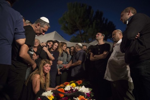 Family, friends, and fellow police officers mourn at the funeral on Mt Herzl in Jerusalem of 29-year