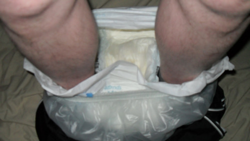 Wet diapers in my plastic pants round my ankles then just plastic pants ready to be pulled up over m