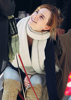 fiftyshadesen:  Emma Watson gives a scratch to a passing dog as she enjoys lunch