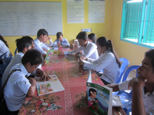 A Peace Corps Volunteer helps build a library for her community in Cambodia