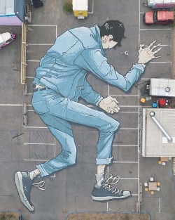 escapekit: Pavement Giants  Melbourne-based artist Kitt Bennett paints larger than life murals on the ground in Melbourne. The almost literal “street” art is best seen from a bird’s eye view and features people, objects, and skeletons that contort