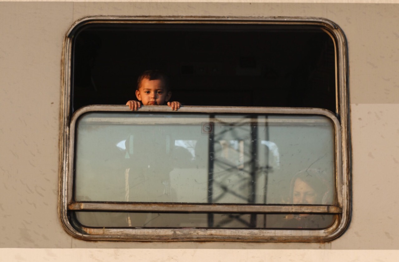 criwes:  Syrian children looking out from the train window in Croatia (2015) by João
