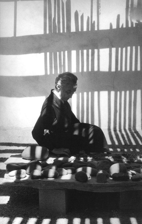 Georgia O'Keeffe sitting with her rock collection, New Mexico  -  John LoengardAmerican b.1934-Photo