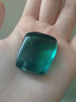 juuzoucore:my lovely piece of blue/green obsidian; the colour is caused by varieties of feldspar in it more than likely