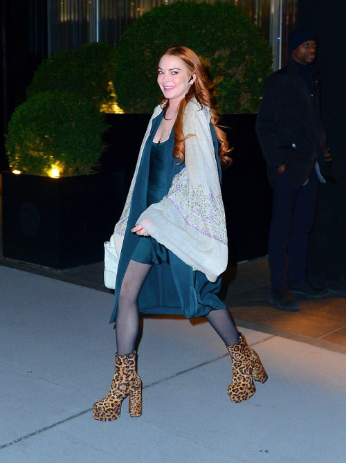 Lindsay Lohan photographed by paparazzi in black pantyhose and some wild boots.