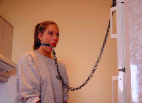 beautyintheballgag:  Sexy redhead gagged with kinky chain ballgag