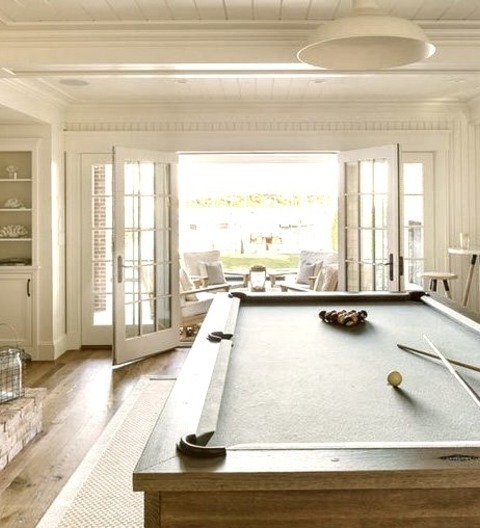 Game Room - Beach Style Family RoomAn Illustration Of A Medium-sized, Open-concept, Medium-tone Wood