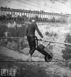 French daredevil Jean-Francois Gravelet Blondin, a.k.a The Great Blondin, pushes a wheelbarrow across a tightrope above the Niagara River Gorge, c. 1859.