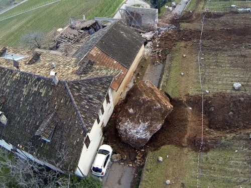 the-gas-station:  Rolling Stones Picture: Last Tuesday, a landslide in Northern Italy produced two huge boulders that barely missed a farmhouse and destroyed a nearby barn as they plowed their way downhill. © Tareom, Source 