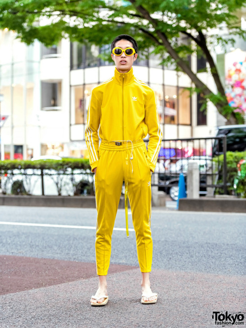 17-year-old Japanese student Moka on the street in Harajuku wearing a yellow Adidas Originals track 