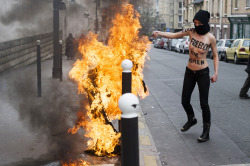 Fohk:  A Femen Activist Burns A Salafist Flag In Front Of The Great Mosque Of Paris,