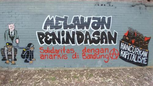 “Fight Oppression / Melawan PenindasanDestroy Capitalism / Hancurkan KapitalismeSolidarity with anar