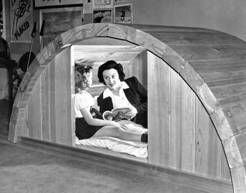 June 2, 1942: This portable solid timber bomb shelter is large enough for three people and takes onl