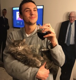 shinyhaunter:  plantmother: My favorite two photos probably in the world. Why does my cat look like she’s about to go off on the roast to end all roasts? Why is my boyfriend holding a glass that says “ghouls just want to have fun”? Modern art  Why