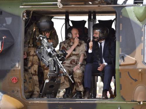 President Emmanuel Macron onboard a French Army NH90 during a visit in Mali. 