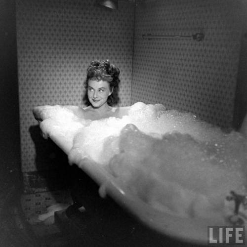 Paulette Goddard shooting the bubble bath scene for Anna Lucasta(Allan Grant. 1949)