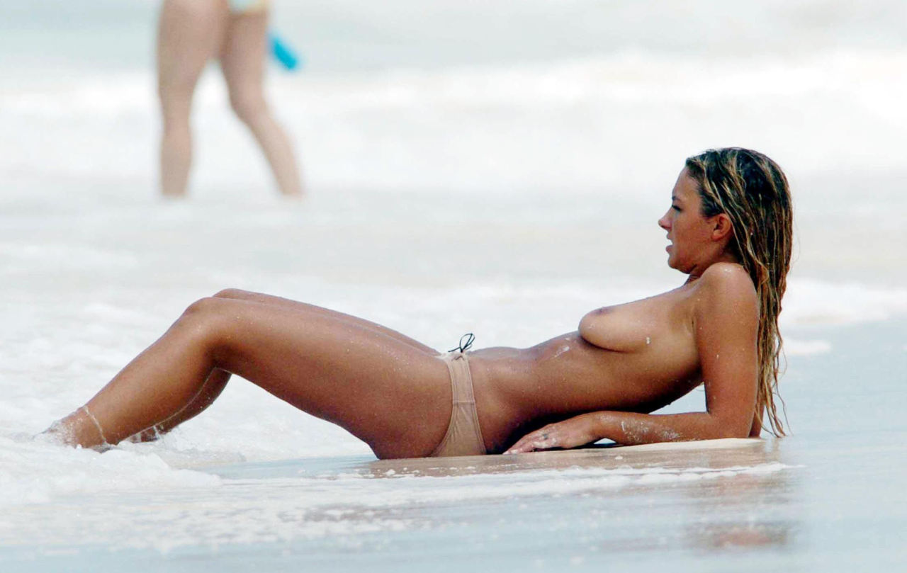 toplessbeachcelebs:  Jodie Marsh (British Model) swimming topless in The Caribbean (May