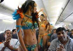 tarrynn:fuckyeahjamaicangirls:  Caribbean Airlines carnival spirit.  dude on the left