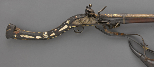 A gold, silver, and bone decorated flintlock jezail musket originating from Afghanistan, 19th centur