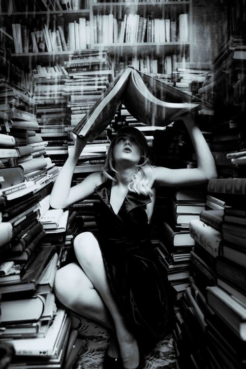 Model reading big with books galore in the fashion shoot Bletchley Park Story. Photograph by Photoci