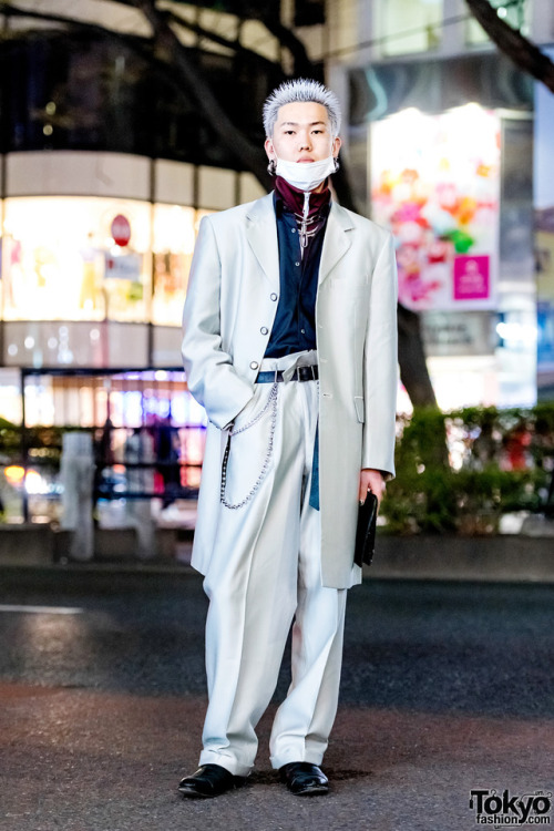 20-year-old Japanese hair stylist Masamune on the street in Harajuku wearing a silver suit from Dog 