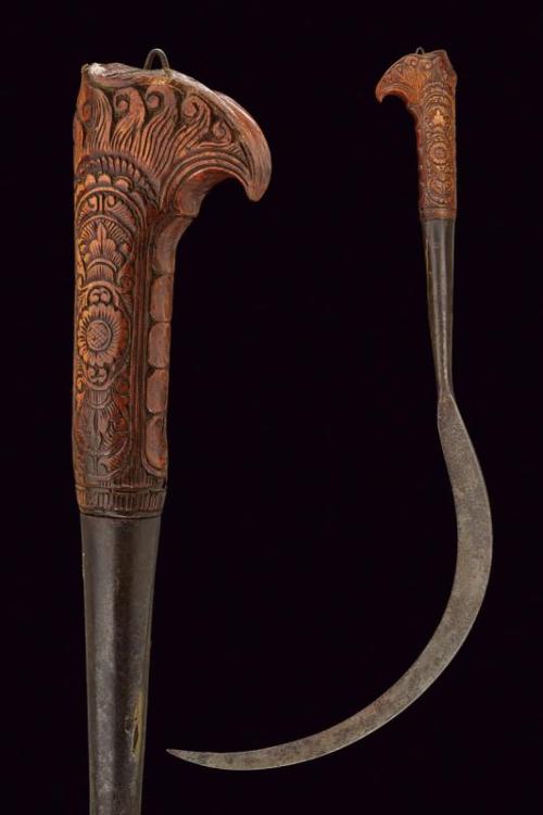 peashooter85: Sickle with carved grip, Indonesia, 18th century. from Czerny’s International Au