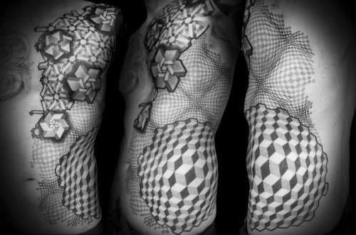 martinekenblog:  Currently working at Tattoo Crew Production, Pierluigi Deliperi’s art style is different than his colleagues because of its geometric nature. His psychedelic patterns become three-dimensional and appear movement flowing on the body,