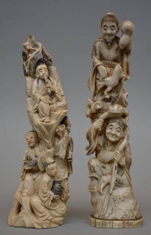 A Japanese ivory okimono depicting two mythical characters, scrimshaw decorated, Meiji period, late 