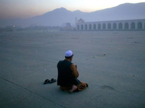 Man Prayingby Richard VogelA man prays outside Eid Gah, the largest mosque in Kabul, Afghanistan. Bu