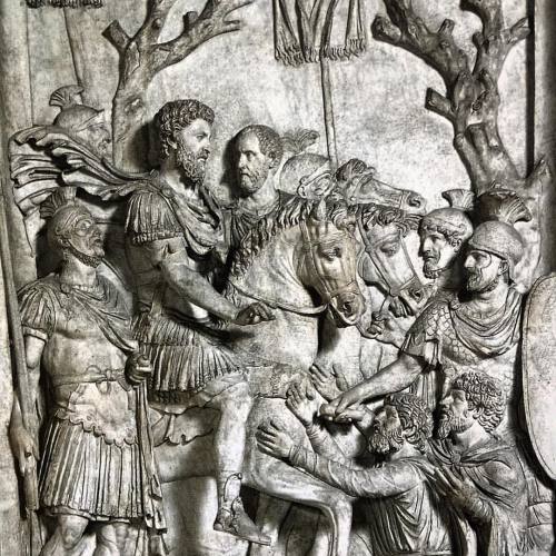 Aurelian relief showing a dedition, the surrender. Defeated barbarians kneel before the emperor Marc