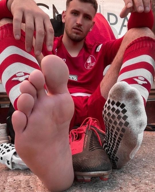 Lick male feet