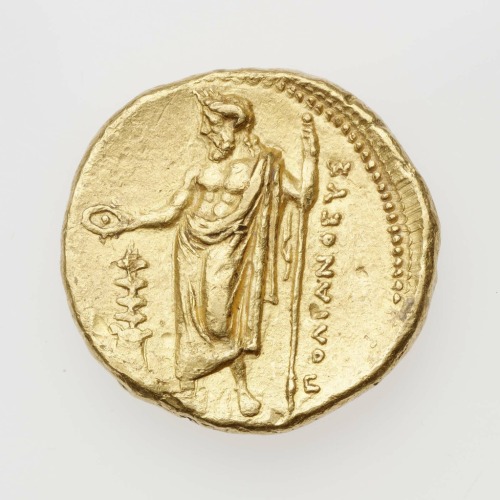 Gold stater of Cyrene, struck under Polianthes, with Nike driving quadriga (obverse) and Zeus Ammon 