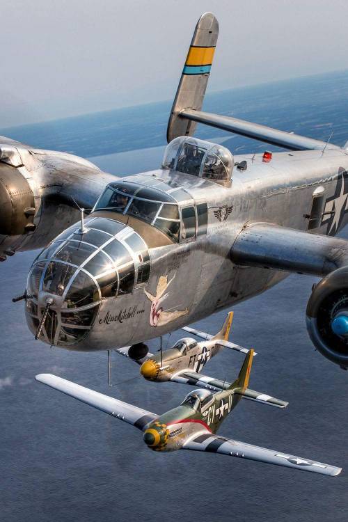 stukablr:North American B-25 Mitchell bomber flanked by a pair of North American P-51 Mustangs.