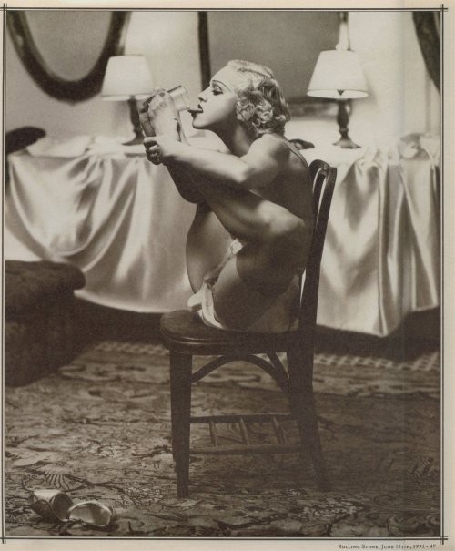 madonnascrapbook:Madonna drinking a glass of milk with her feet - photographed by Steven Meisel for 