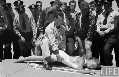 Demonstrating a new resuscitation method to police officer(Wallace Kirkland. 1951)