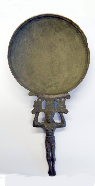 A bronze mirror with a female figure as the handle Images from the British Museum via their online c