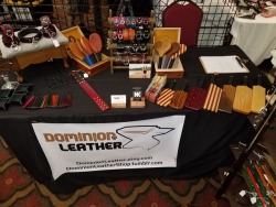 dominionleathershop: Well….Dominion Leather is setup!  I am next to some large booths so it makes me look small…but that is ok!  It’s all about the product and the effort I put into it!  You will also see I have a number of paddles and clamps from
