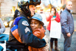 weallheartonedirection:  Young man had sign saying, “free hugs”, at a Portland Ferguson rally. This cop took him up on the offer.