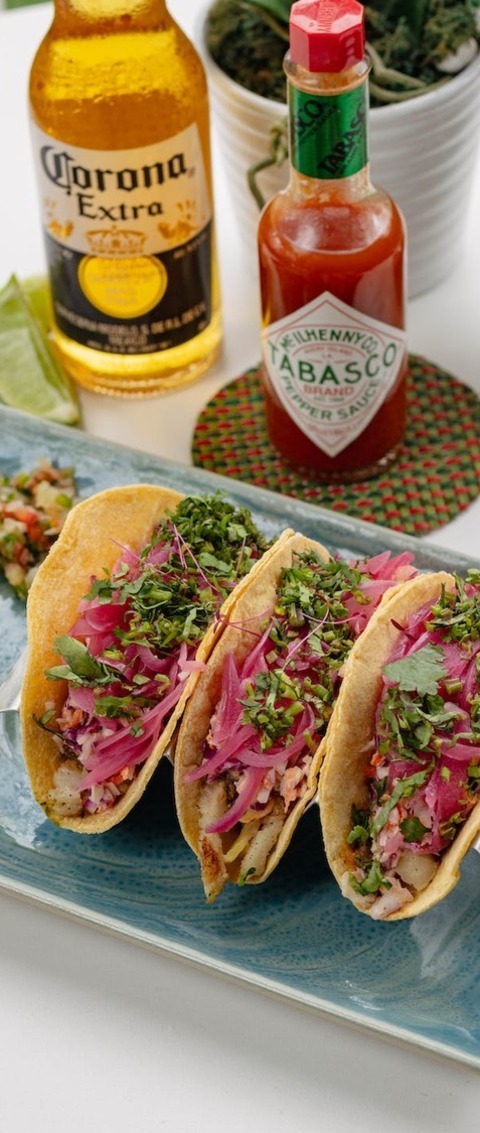 Fish Tacos With Pickled Onions And Avocado Crema